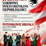 Plakat promuje obchody 11 listopada, pokazuje grupę śpiewających osób. Dominują kolory biały i czerwony, w tle flaga Polski i herb z dzikiem. Informacje o mszy i koncercie, tekst w kolorze czerwonym i czarnym.